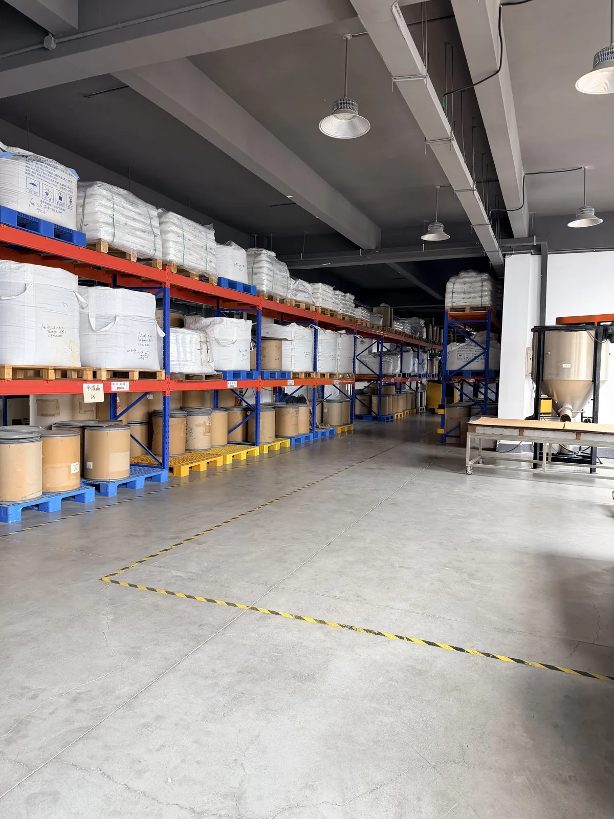 Production hall with racking, raw material and finished goods